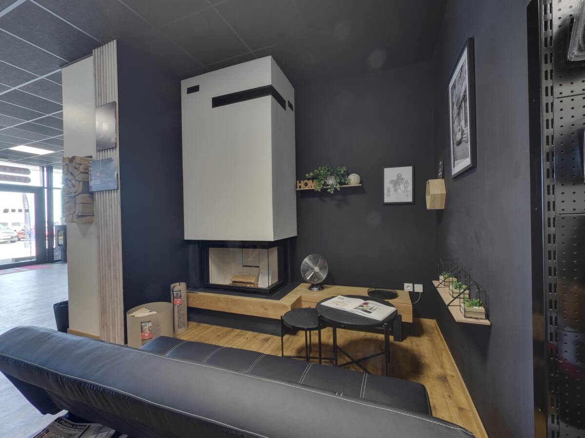 Corner fireplace staged in a living-room setting at the Brisach Bernay showroom